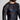 A man with a beard wears the Oni Legend Flex Lite Rashguard Black, featuring text patterns on one sleeve and a chest logo, standing against a plain light background.
