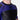 A person wearing the Competition Ranked Rashguard Purple, a fitted black and dark purple short-sleeve athletic top with a small chest logo. The image is cropped to show only the upper torso and part of the neck.