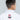 Seen from behind, a young boy with short dark hair wears the All Around Kids BJJ Gi White, featuring the FUJI kimono logo embroidered on the collar. The background is plain and light gray.