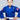 A young boy wears the Kids Competition BJJ Gi Blue with a white belt, standing confidently with his hands on his hips against a plain light gray background.