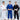 Three children in martial arts uniforms stand smiling. The child in the center wears the Kids Competition BJJ Gi Blue, while the others wear white and black uniforms. All are wearing white belts.