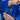 A person folds their arm in a blue Lightweight BJJ Gi, revealing the FUJI brand label inside the sleeve.