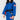 A person wearing the Womens Competition BJJ Gi Blue with red and white patches and a black belt stands against a plain light background, their face partially out of frame.