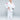 A young boy stands confidently in the Kids Competition BJJ Gi White with a white belt, barefoot, hands on hips, looking at the camera against a plain light gray background.