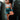 Woman in athletic wear posing in a boxing ring