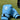 Blue boxing gloves on grass with a blurred background